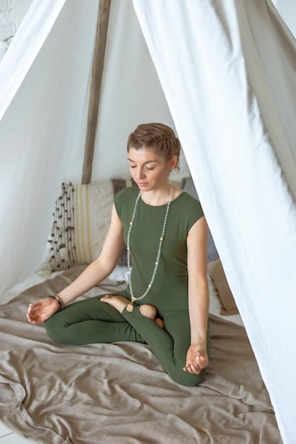 A person meditating in comfortable, loose-fitting clothing in a serene environment, highlighting the stress-reducing effect of clothing.