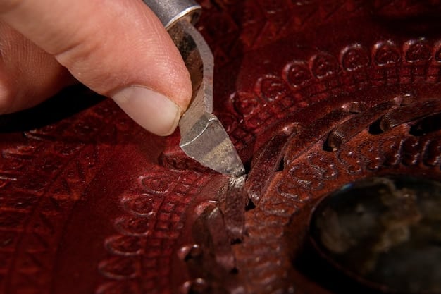 Close-up shot of the intricate details of a handmade leather handbag, showcasing the artistic craftsmanship of a collaboration between a Spanish designer and a leather artisan. The handbag should have unique stitching patterns and hand-painted designs.