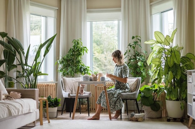 A living room in a renovated house featuring large, energy-efficient windows that let in natural light. The room is decorated in a modern style with plants and comfortable furniture.