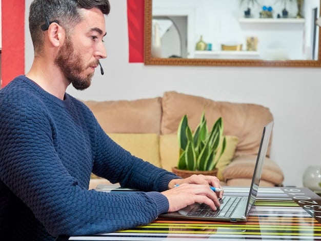 A person working on a computer while consulting and browsing on the internet.