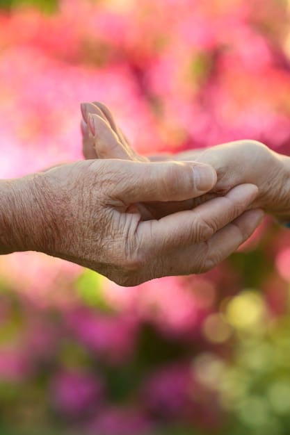 A close-up of hands - a caregiver gently holding the hand of an elderly person, symbolizing support and compassion. The background is blurred to keep the focus on the hands.
